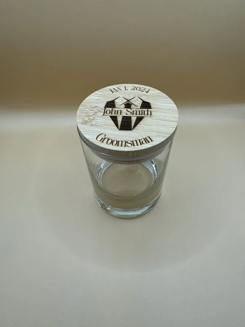 Bamboo glass topper engraved with a name, wedding date, and groomsman design